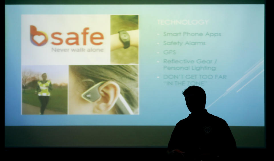 In this Tuesday, Sept. 11, 2018 photo, Des Moines police spokesman Paul Parizek leads a runner's safety talk. The recent killings of female athletes have raised questions about how women can defend themselves and why they must be ready to fight off attackers in the first place. (AP Photo/Charlie Neibergall)