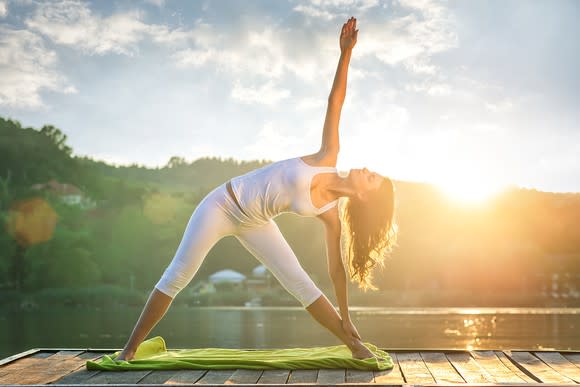 A woman holding a yoga pose.