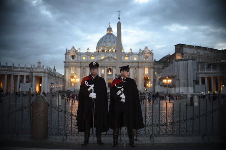 Italian carabinieri police stand in front of St Peter's square on March 11, 2013 at the Vatican. The historic conclave to choose a successor for the first pope to resign in over 700 years begins on Tuesday, with the world in suspense over a secret election with no clear frontrunner