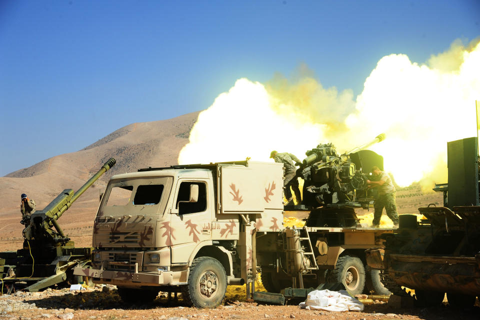 Lebanese Hezbollah fighters fire at a position of the Islamic State group in Syria’s Qalamoun region in 2017. (Photo: Ammar Safarjalani/Xinhua via Zuma Wire)