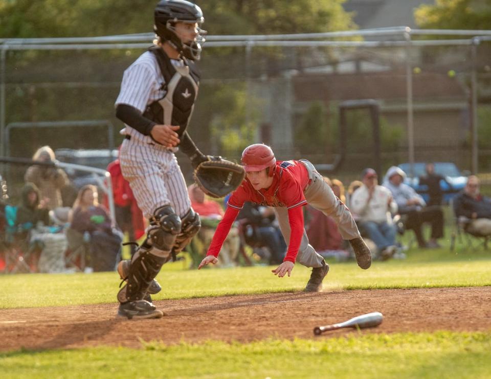 Hornell centerfielder Gates Miller takes flight as he dives safely into home to score a run Wednesday as the Red Raiders advanced to the Class B1 finals against Pal-Mac Saturday afternoon in Batavia.