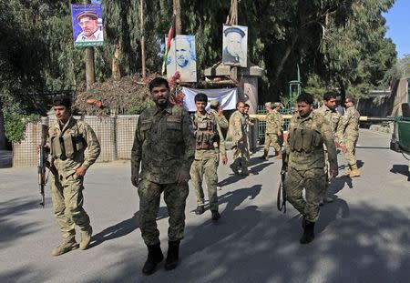 Afghan civil order policemen stand guard at the compound of a provincial governor's office in Jalalabad April 8, 2015. REUTERS/Parwiz