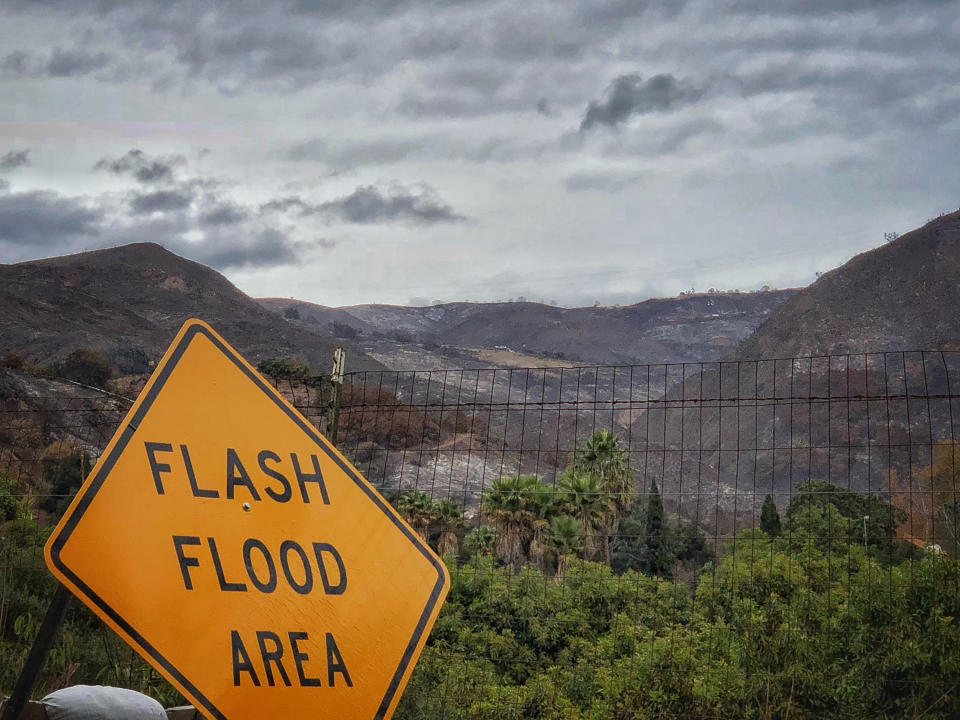 <p>A flash flood area sign is posted, as evacuations have been issued for several fire-ravaged communities in Santa Barbara, Calif., Monday, Jan. 8, 2018. (Photo: Mike Eliason/Santa Barbara County Fire Department via AP) </p>