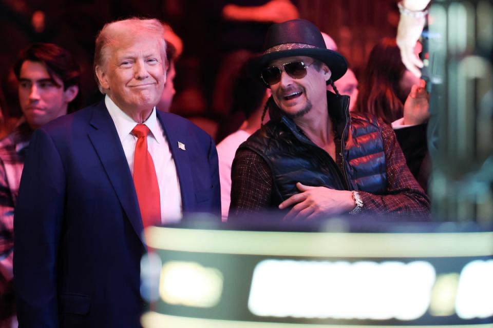 Kid Rock with Donald Trump at a UFC event in December. The MAGA loyalist is accused of using the n-word and waving a gun during a Rolling Stone interview (Getty Images)