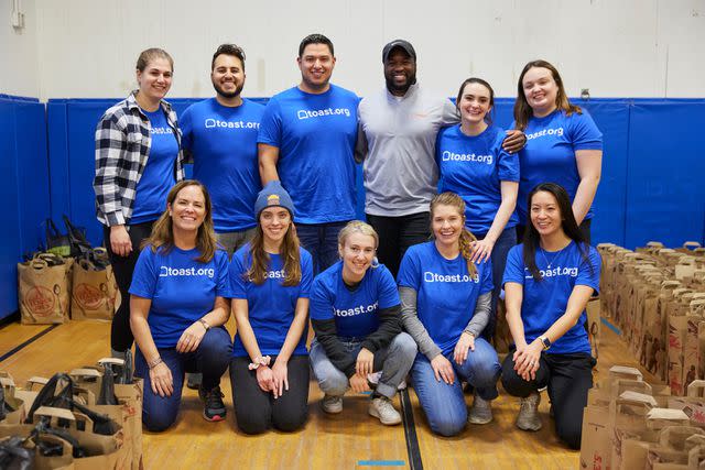 <p>Dana J. Quigley Photography</p> Boston Toasters volunteered with Toast.org by packing Thanksgiving meal kits during the Season of Giving campaign.