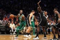 Nov 14, 2017; Brooklyn, NY, USA; Boston Celtics point guard Kyrie Irving (11) is fouled by Brooklyn Nets small forward Quincy Acy (13) during the third quarter at Barclays Center. Mandatory Credit: Brad Penner-USA TODAY Sports