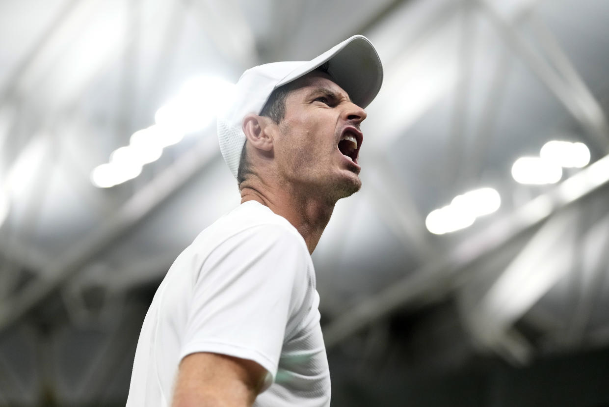 Andy Murray celebrates after winning a second-set tie break over Stefanos Tsitsipas. (AP Photo/Kirsty Wigglesworth)