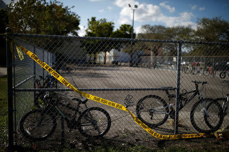 The bicycles that were left behind are seen at the Marjory Stoneman Douglas High School, after the police security perimeter was removed, following a mass shooting in Parkland, Florida, U.S., February 18, 2018. REUTERS/Carlos Garcia Rawlins