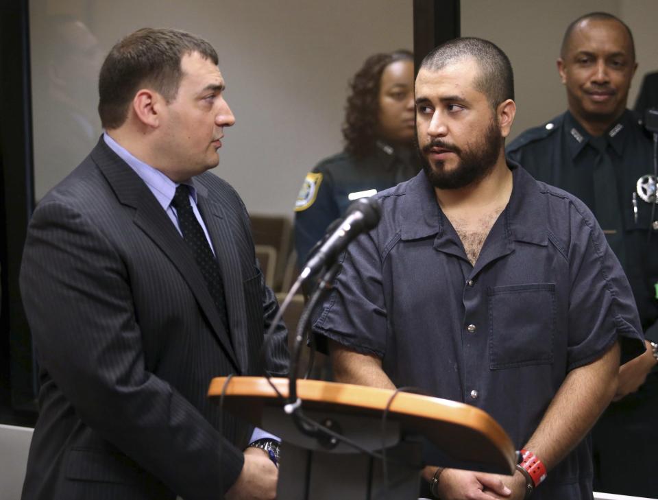 George Zimmerman speaks to defense counsel during a first-appearance hearing in Sanford, Florida