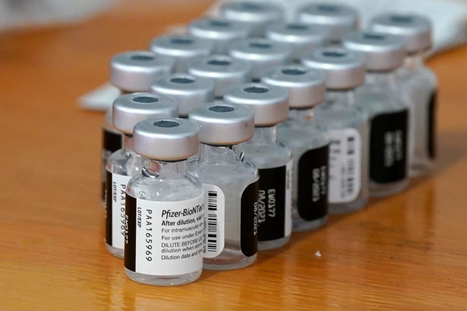 Vials of Pfizer COVID-19 vaccines sit ready for use at a vaccine clinic.