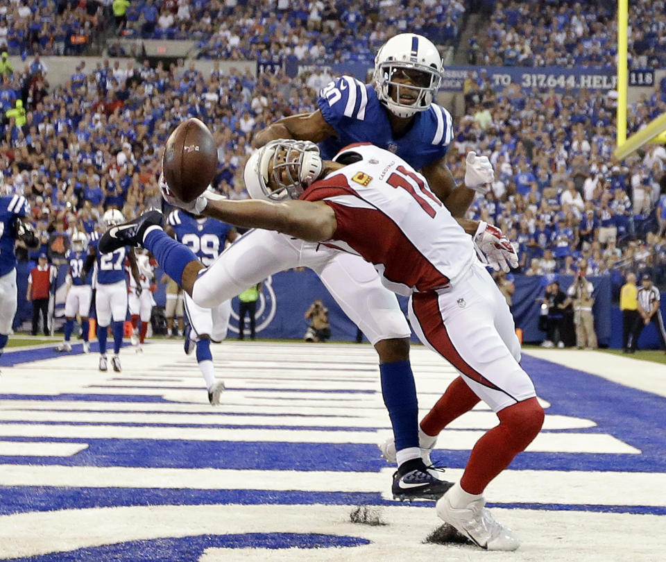 <p>Arizona Cardinals’ Larry Fitzgerald (11) tries to make a catch while being defended by Indianapolis Colts’ Rashaan Melvin during the first half of an NFL football game Sunday, Sept. 17, 2017, in Indianapolis. The pass was incomplete. (AP Photo/AJ Mast) </p>