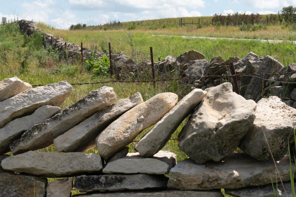Limestone rocks are meticulously placed atop a stone fence at Paul Miller's Rock Hill Ranch along K-99 highway, south of Alma in Wabaunsee County. Miller's property stands along the Native Stone Scenic Byway.