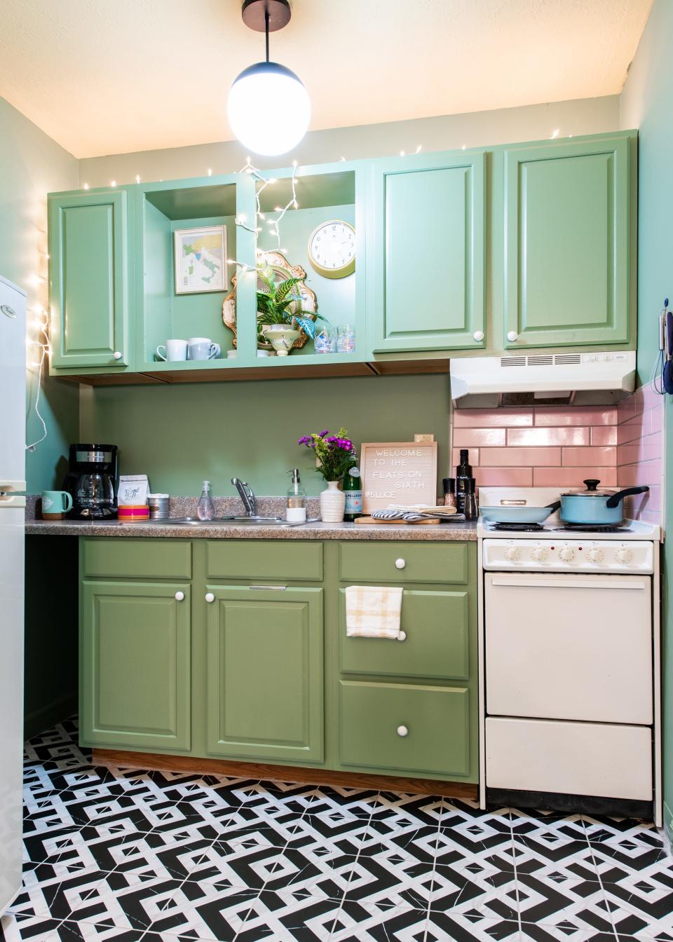 A studio apartment kitchen McMahan and her business partner renovated in their Old Louisville apartment building. McMahan took inspiration for the color palette from a Wes Anderson-designed cafe in Milan.