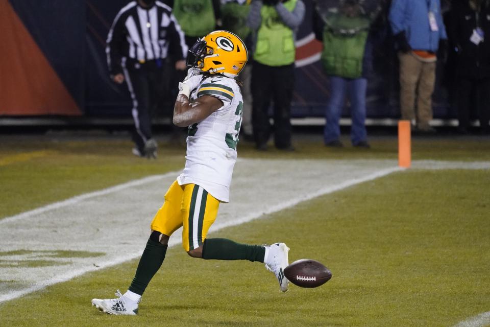 Green Bay Packers' Aaron Jones reacts after running for a touchdown during the second half of an NFL football game against the Chicago Bears Sunday, Jan. 3, 2021, in Chicago. (AP Photo/Nam Y. Huh)