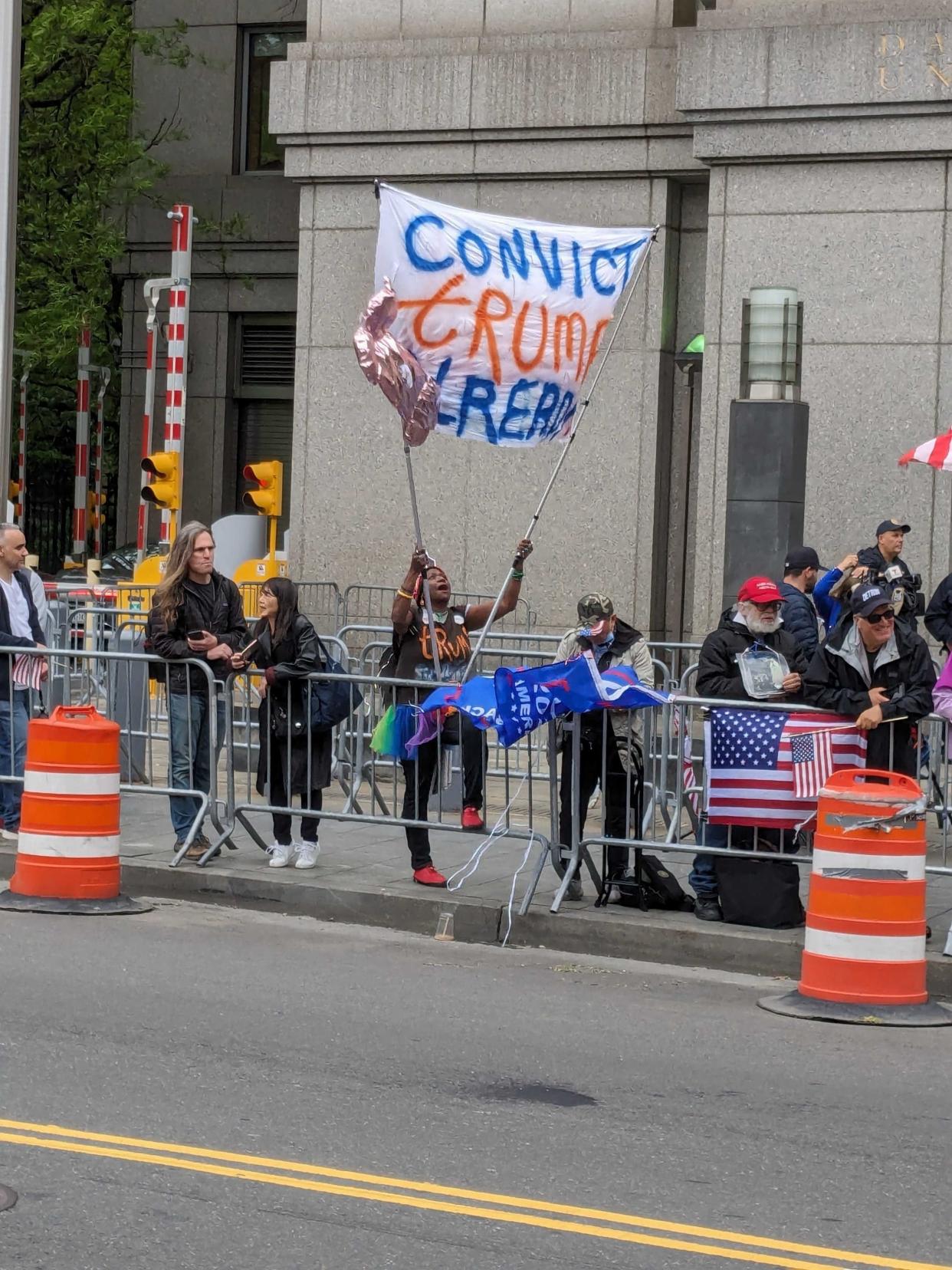 An anti-Trump protester outside the Manhattan federal corruption trial of New Jersey Democrat Sen. Robert Menendez.