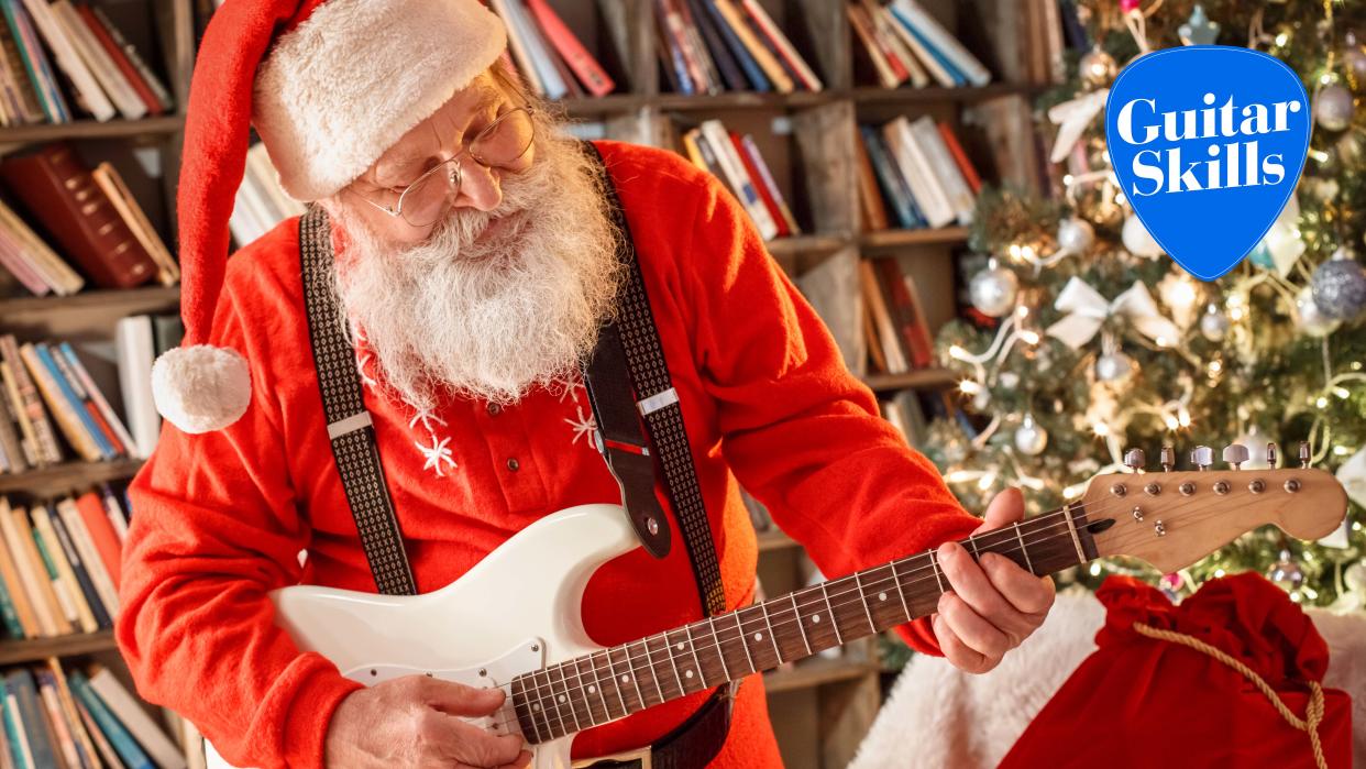  Santa Claus in the library celebration concept playing guitar. 
