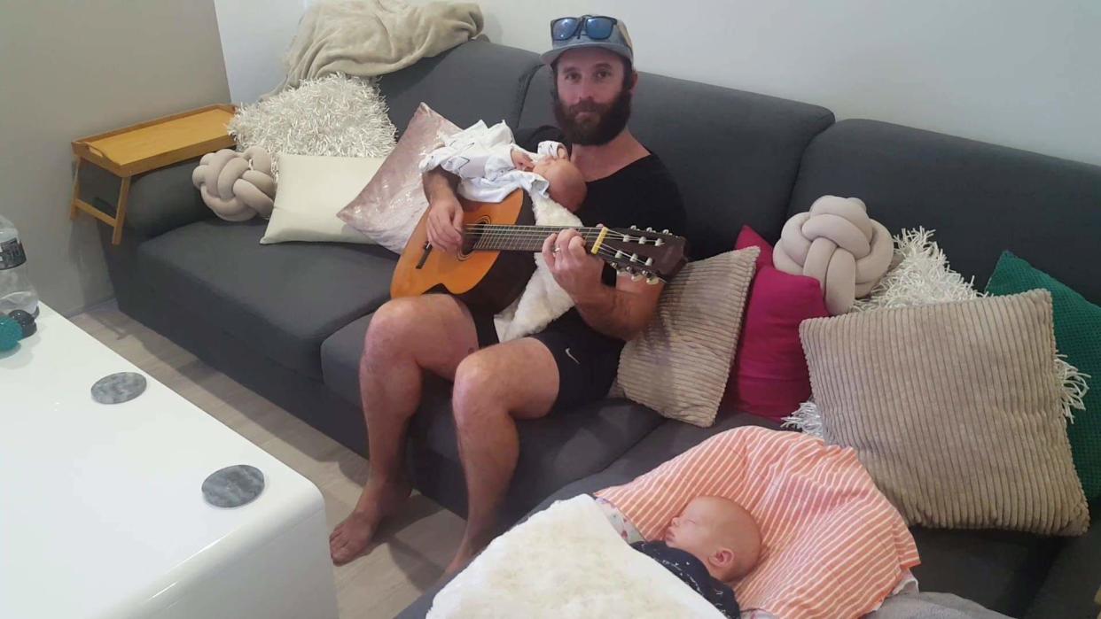 Neil Perry soothes twins Elliot and Isla with his original lullaby Photo: Supplied