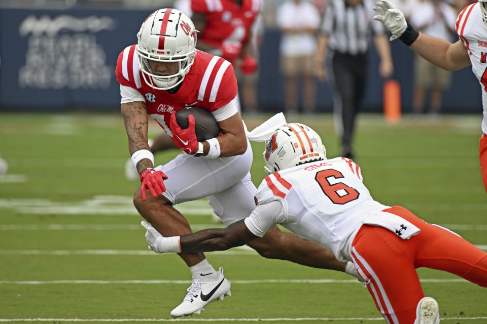 Mercer cornerback Cam Sims (6) tackles Mississippi wide receiver Jordan Watkins (11) during the first half of an NCAA college football game in Oxford, Miss., Saturday, Sept. 2, 2023. (AP Photo/Thomas Graning)