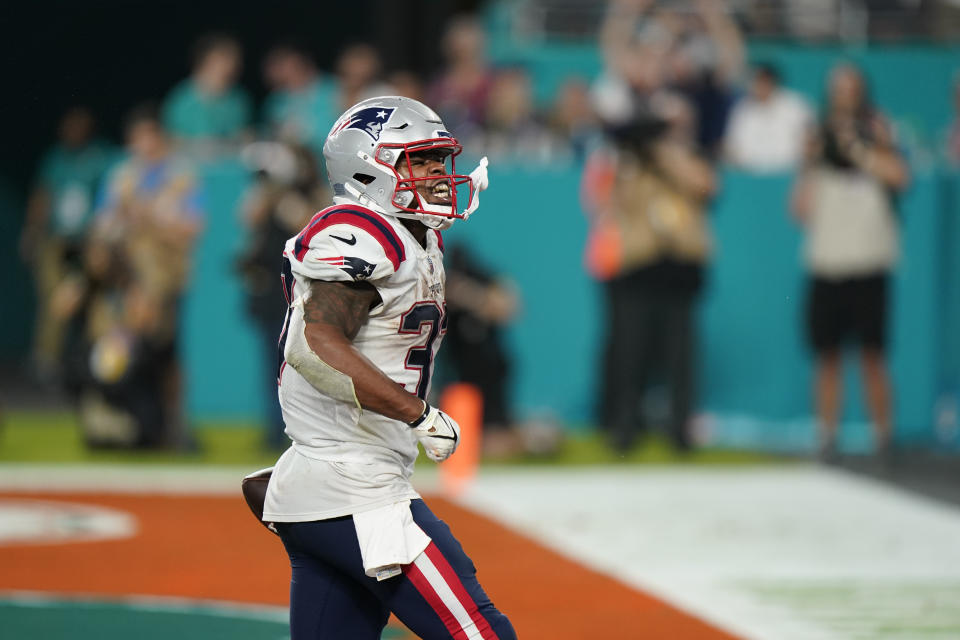New England Patriots running back Damien Harris (37) celebrates after scoring a touchdown during the second half of an NFL football game against the Miami Dolphins, Sunday, Jan. 9, 2022, in Miami Gardens, Fla. (AP Photo/Wilfredo Lee)