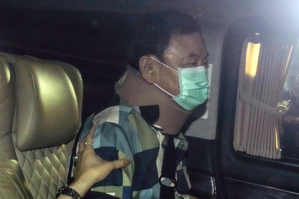 Former Thai Prime Minister Thaksin Shinawatra, center, sits in a vehicle with his daughters Paetongtarn and Pinthongta after being released on parole Sunday, Feb. 18, 2024, n Bangkok, Thailand. Thaksin was released from Police General Hospital where for the last six months he had been serving time for corruption-related offenses. (AP Photo/Sakchai Lalit)