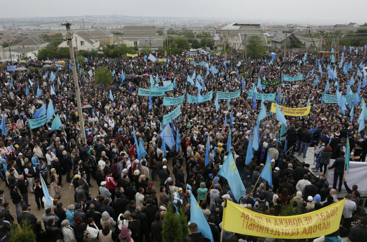 <span class="caption">Crimean Tatars gathered for a rally commemorating the 70th anniversary of Stalin's mass deportation, in Simferopol, Crimea, on May 18, 2014. </span> <span class="attribution"><a class="link " href="https://newsroom.ap.org/detail/CrimeaTatars/787fdb2ac4624ded85e2fdabe56d8f95/photo?Query=crimea%20tatar&mediaType=photo&sortBy=&dateRange=Anytime&totalCount=259&currentItemNo=15" rel="nofollow noopener" target="_blank" data-ylk="slk:AP Photo/Alexander Polegenko;elm:context_link;itc:0;sec:content-canvas">AP Photo/Alexander Polegenko</a></span>