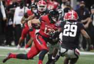 Cincinnati wide receiver Alec Pierce gets past Georgia defenders for a touchdown during the first half in the NCAA college football Peach Bowl game on Friday, Jan. 1, 2021, in Atlanta. (Curtis Compton/Atlanta Journal-Constitution via AP)