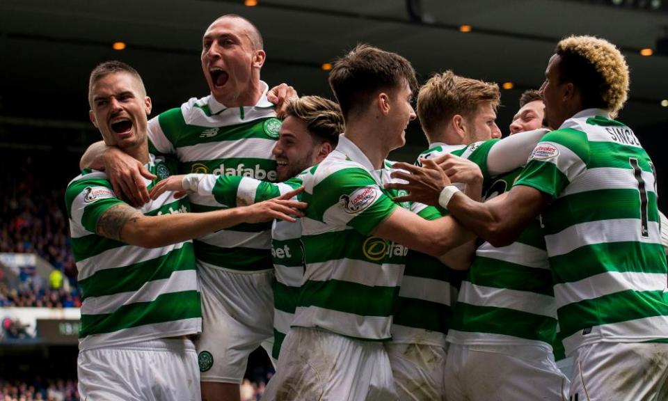 Celtic celebrate after Callum McGregor scored their third against Rangers.