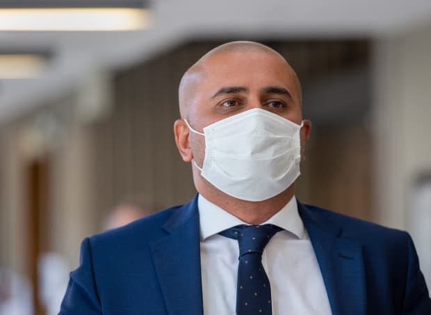 Bassam Al-Rawi walks outside the courtroom during a break at Nova Scotia Supreme Court in Halifax in August 2020. (Andrew Vaughan/The Canadian Press - image credit)