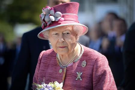 FILE PHOTO - Britain's Queen Elizabeth II visits The Kelpies sculpture to unveil a plaque to name the Queen Elizabeth II canal near Falkirk, Scotland, Britain, July 5th 2017. REUTERS/Mary Turner