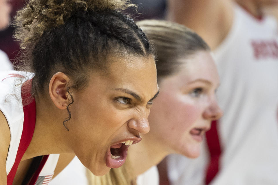 Nebraska's Kendall Coley, left, cheers on her teammates from the bench during the second half during an NCAA college basketball game against Rutgers at Pinnacle Bank Arena, Saturday, Feb. 3, 2024, in Lincoln, Neb. (Kenneth Ferriera/Lincoln Journal Star via AP)