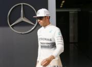 Mercedes Formula One driver Lewis Hamilton of Britain comes out of the pit lane after completed the first practice session of the Abu Dhabi F1 Grand Prix at the Yas Marina circuit in Abu Dhabi November 21, 2014. REUTERS/Ahmed Jadallah