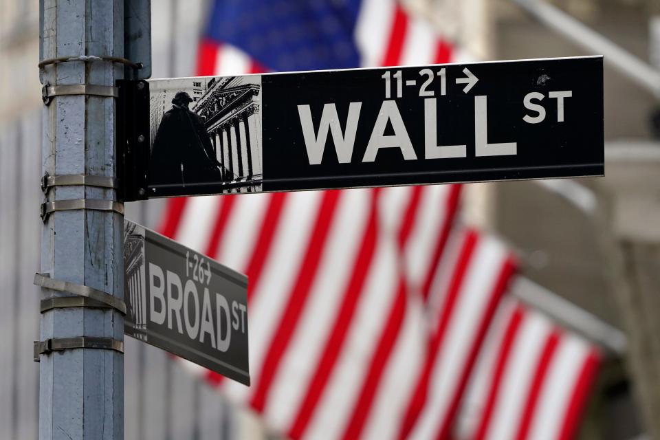 FILE- In this Nov. 23, 2020, file photo, a street sign is displayed at the New York Stock Exchange in New York.  (AP Photo/Seth Wenig, File)