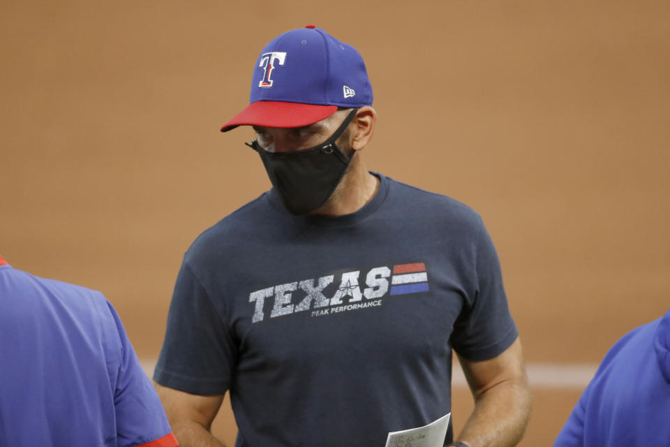 Texas Rangers manager Chris Woodward stands on the field during an intrasquad game at a baseball practice at Globe Life Field in Arlington, Texas, Monday, July 20, 2020. (AP Photo/Roger Steinman)