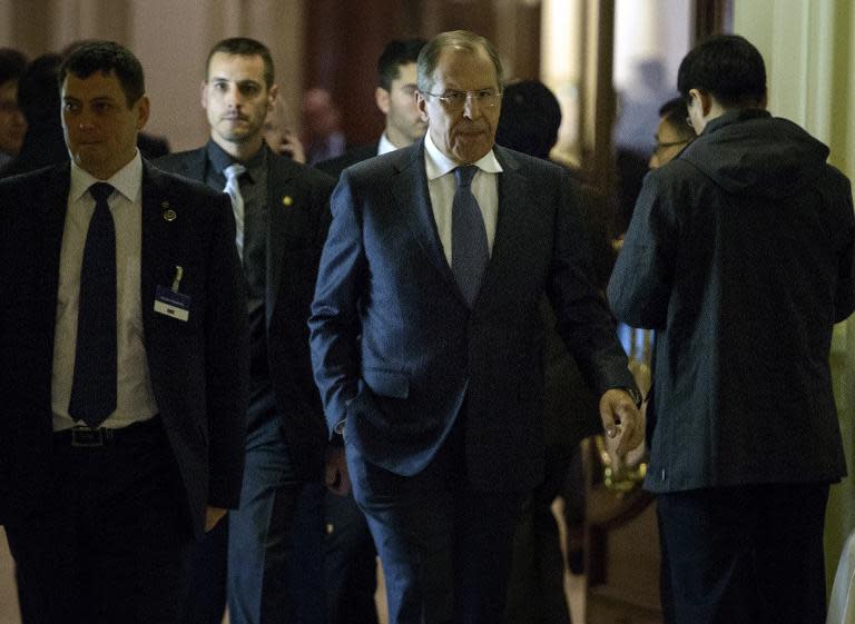 Russian Foreign Minister Sergei Lavrov (C) walks in the Beau Rivage Palace Hotel in Lausanne on March 31, 2015, during negotiations on Iran's nuclear programme