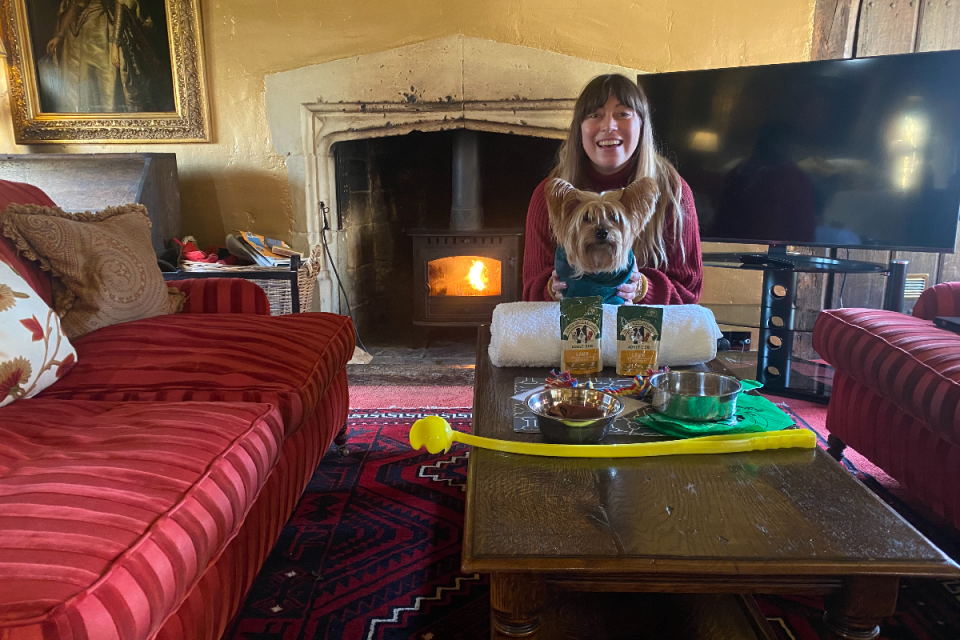 Hannah and her dog Arthur enjoying their in-room treats, all part of the service with dog holiday provider Pet’s Pyjamas