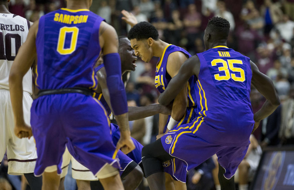 LSU guard Tremont Waters (3) is swarmed by teammates as time expires on an NCAA college basketball game against Texas A&M Saturday, Jan. 6, 2018, in College Station, Texas. Waters hit a three point shot with .7 seconds left to go ahead of Texas A&M. (AP Photo/Sam Craft)