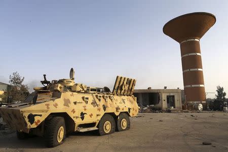 An armoured vehicle is seen after fighting between Libyan special forces and ex-rebel fighters of the Benghazi Shura Council in the eastern city of Benghazi July 30, 2014. REUTERS/Stringer