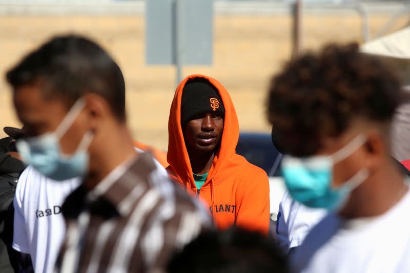 FILE PHOTO: A migrant is seen at a provisional campsite outside El Chaparral border crossing, hoping to cross and request asylum in the U.S, in Tijuana