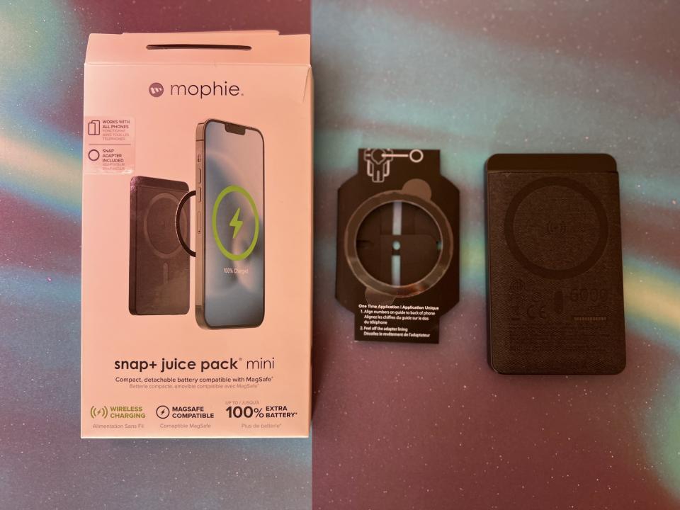 Mophie snap plus juice pack mini on surface with box.