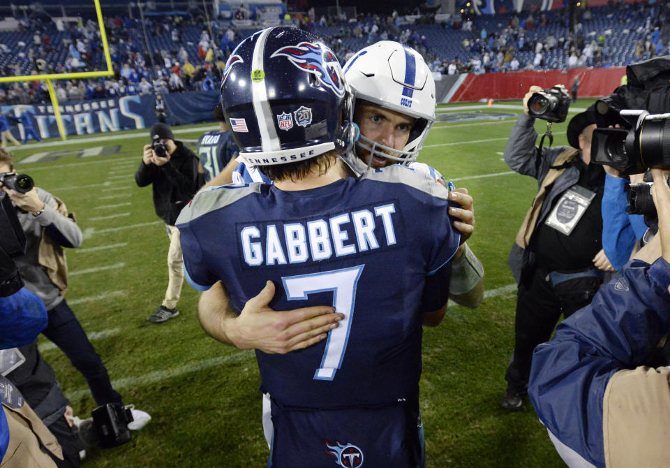 Tennessee Titans quarterback Blaine Gabbert (7) hugs Indianapolis Colts quarterback Andrew Luck after an NFL football game Sunday, Dec. 30, 2018, in Nashville, Tenn. The Colts won 33-17.(AP Photo/Mark Zaleski)