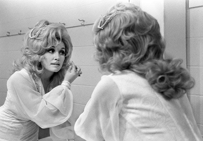 Dolly Parton prepares backstage for an RCA Records breakfast and show at the Nashville Municipal Auditorium in 1973.