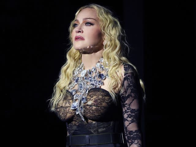 <p>Kevin Mazur/WireImage</p> Madonna performs during The Celebration Tour at The O2 Arena on October 15, 2023 in London, England.