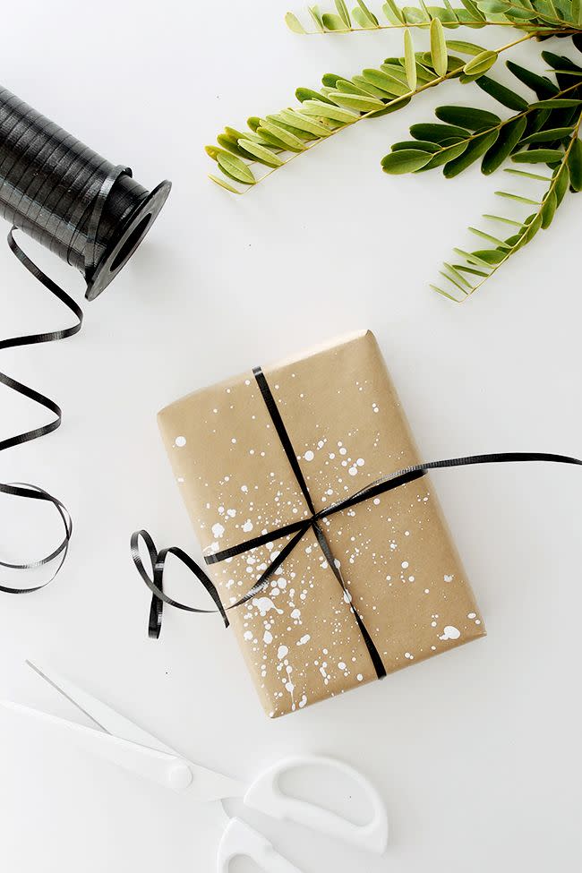 <p>Here’s a fun way to show off your artistic skills for the holidays. Add white paint splatters to kraft paper and finish it off with black ribbon, creating a look that’s equal parts creative and modern.<br></p><p><strong>Get the tutorial at <a href="http://almostmakesperfect.com/2015/12/07/four-diy-gift-wrap-ideas/" rel="nofollow noopener" target="_blank" data-ylk="slk:Almost Makes Perfect;elm:context_link;itc:0;sec:content-canvas" class="link ">Almost Makes Perfect</a>. </strong> </p>