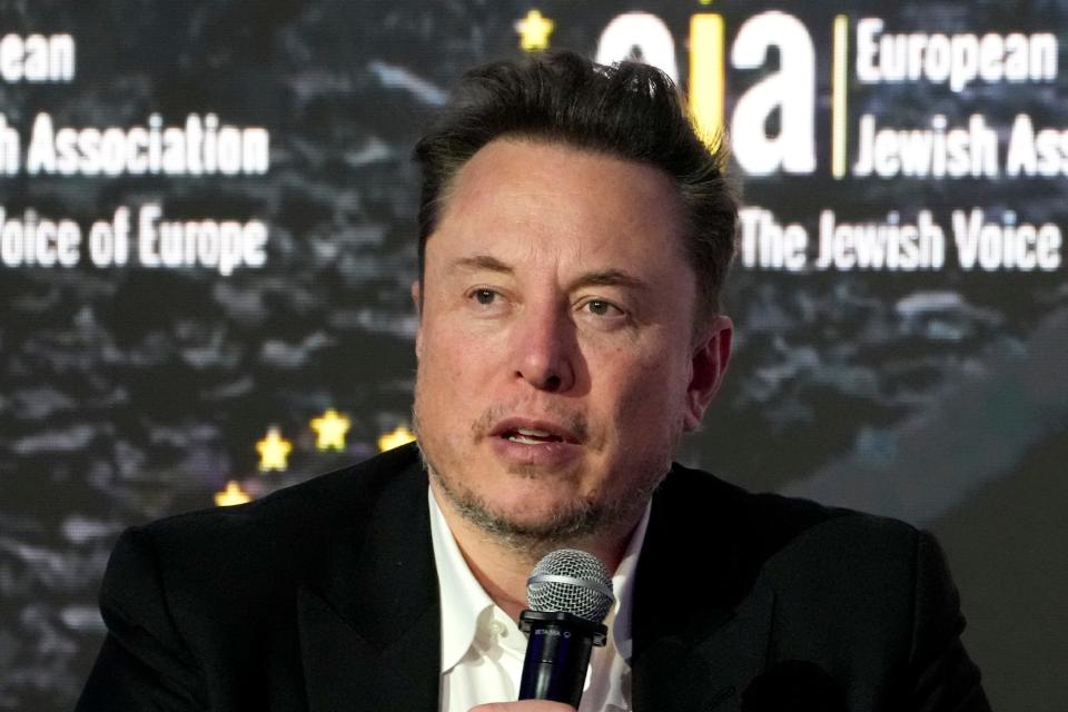 Elon Musk addresses the European Jewish Association's conference, in Krakow, Poland, Monday, Jan. 22, 2024. Musk’s brain implant company Neuralink has moved its legal corporate home from Delaware to Nevada. The move came just over a week after a Delaware judge struck down Musk’s $55.8 billion pay package as CEO of Tesla.