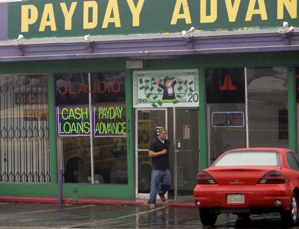 FILE - In this Thursday, Aug. 3, 2006, file photo, The exterior of a Payday Advance store is seen in Oceanside, Calif. California created what supporters called its own nation-leading, state-level version of the federal Consumer Financial Protection Bureau after critics said the Trump administration significantly weakened national protections, Friday, Sept. 25, 2020. The legislation that Gov. Gavin Newsom signed into law changes the existing Department of Business Oversight into the Department of Financial Protection and Innovation in what proponents said is the first such move by any state. (AP Photo/Lenny Ignelzi, File)