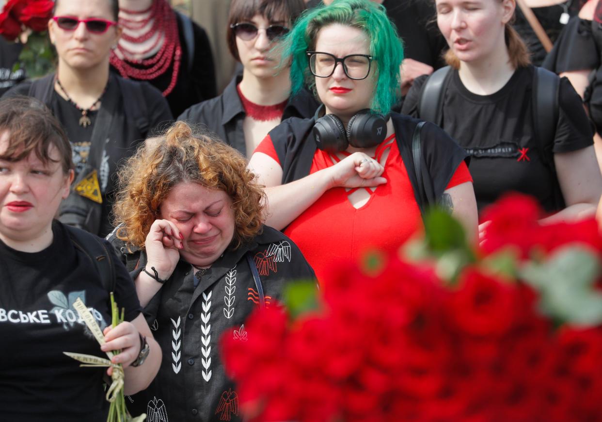 Relatives, friends, and comrades attend the farewell ceremony (EPA)