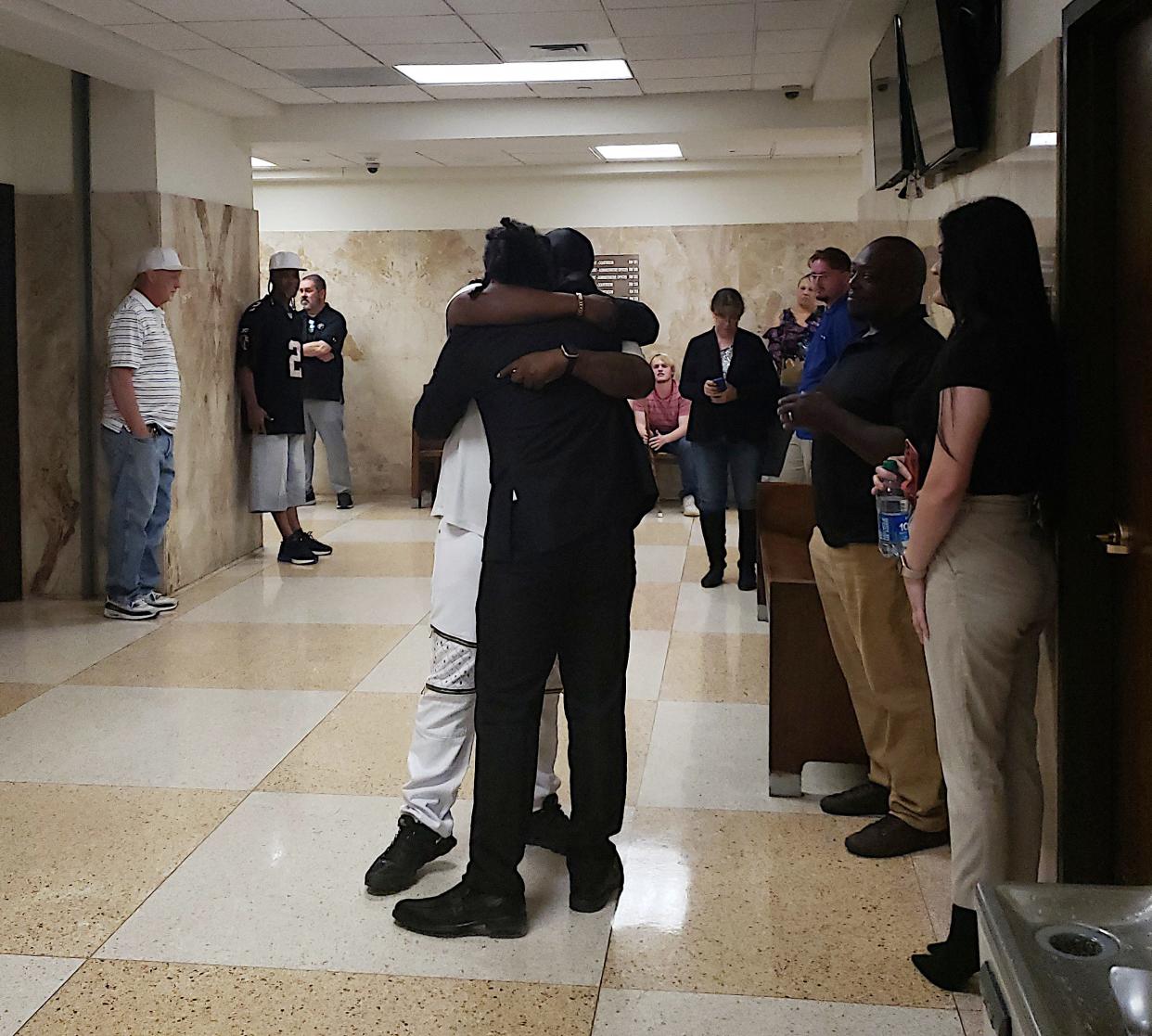 Tazmin Paul embraces his brother Friday after jurors in the 364th District Court returned a verdict finding him not guilty in the Aug. 9, 2021 shooting death of Seattle Salazar.