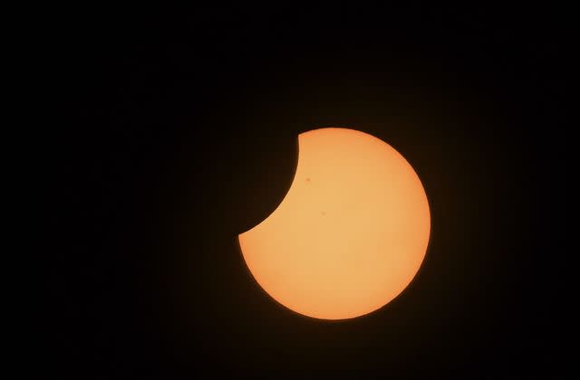 <p>JUAN BARRETO/AFP via Getty</p> 2023 Eclipse in Bogota