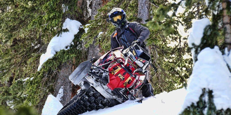 A snowmobile featuring Fox components.