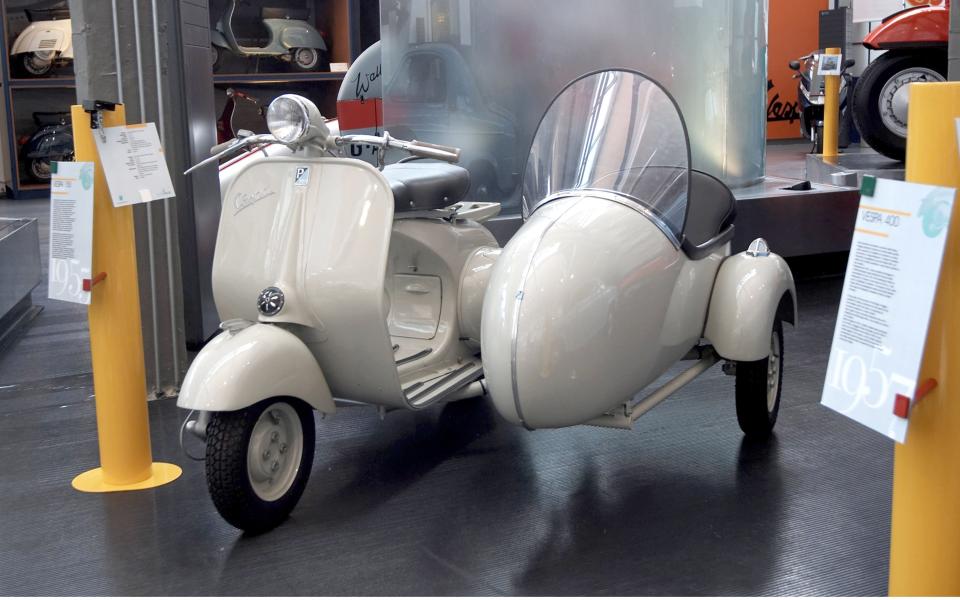 A Vespa with sidecar at the Piaggio museum in Rome. - Credit: International/REX/Shutterstock